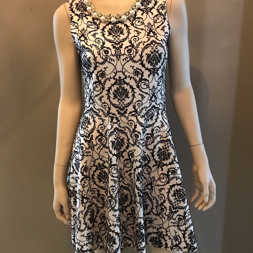 White dress with black embossing